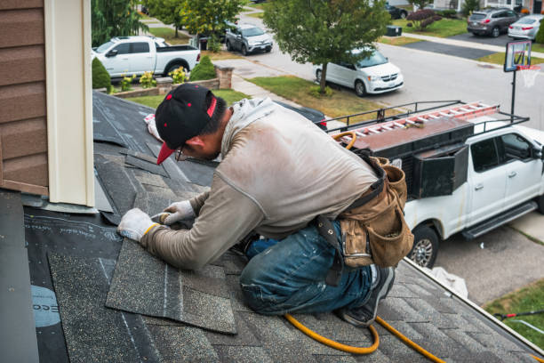 Professional Roofing technician working in Wellesley, MA